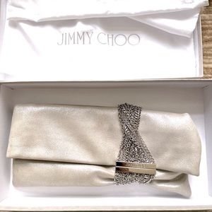 Jimmy Choo silver clutch. Used once, perfect condition with duster and box.